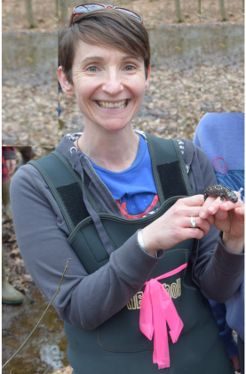Dr. Van Meter holding a marbled salamander in Wetlands Ecology lab.